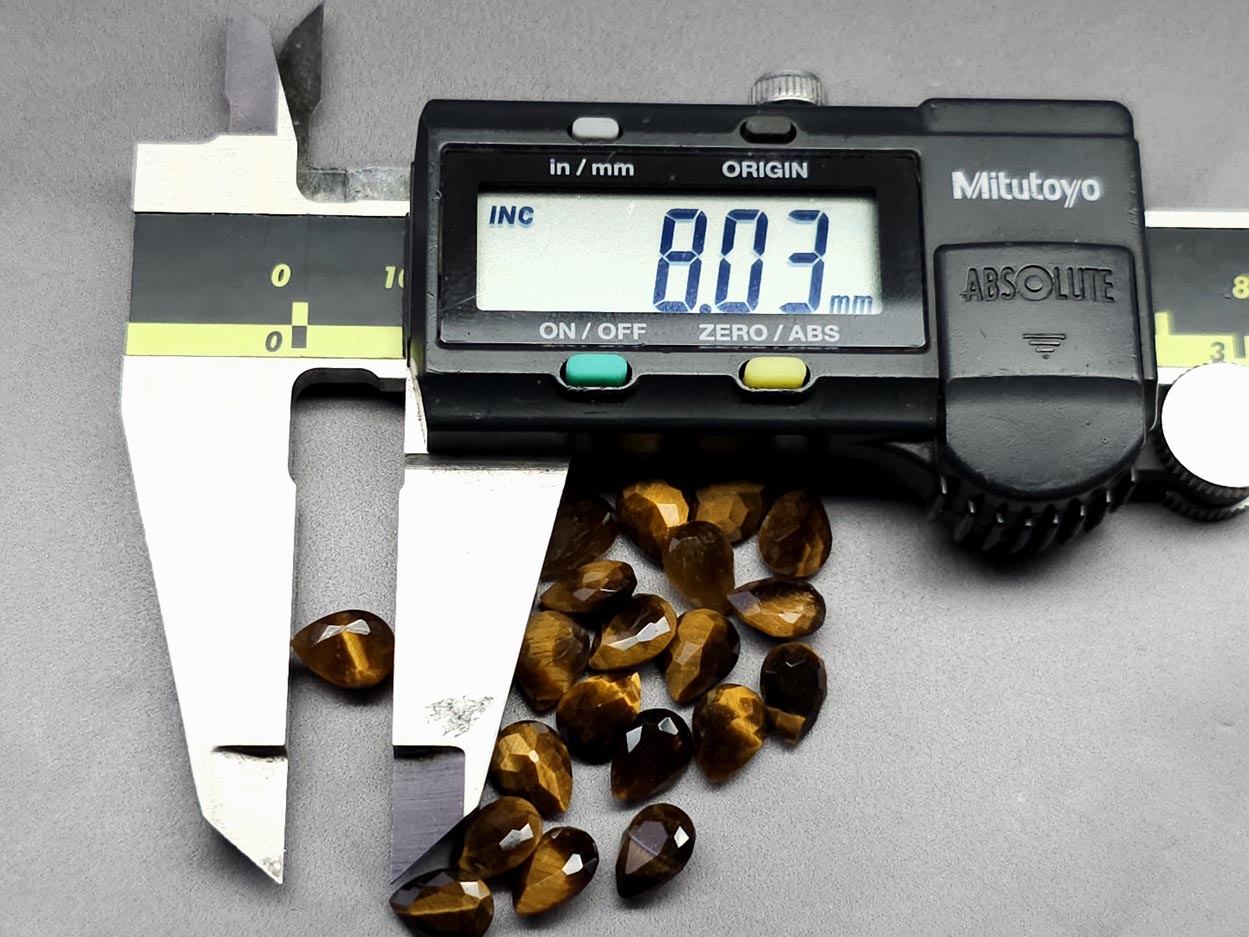 Tigers eye - faceted pear - 8 mm