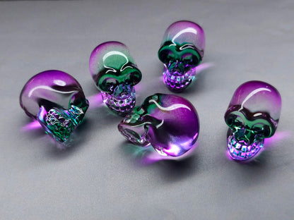 6mm pink glass skull bead close up showing surface detail