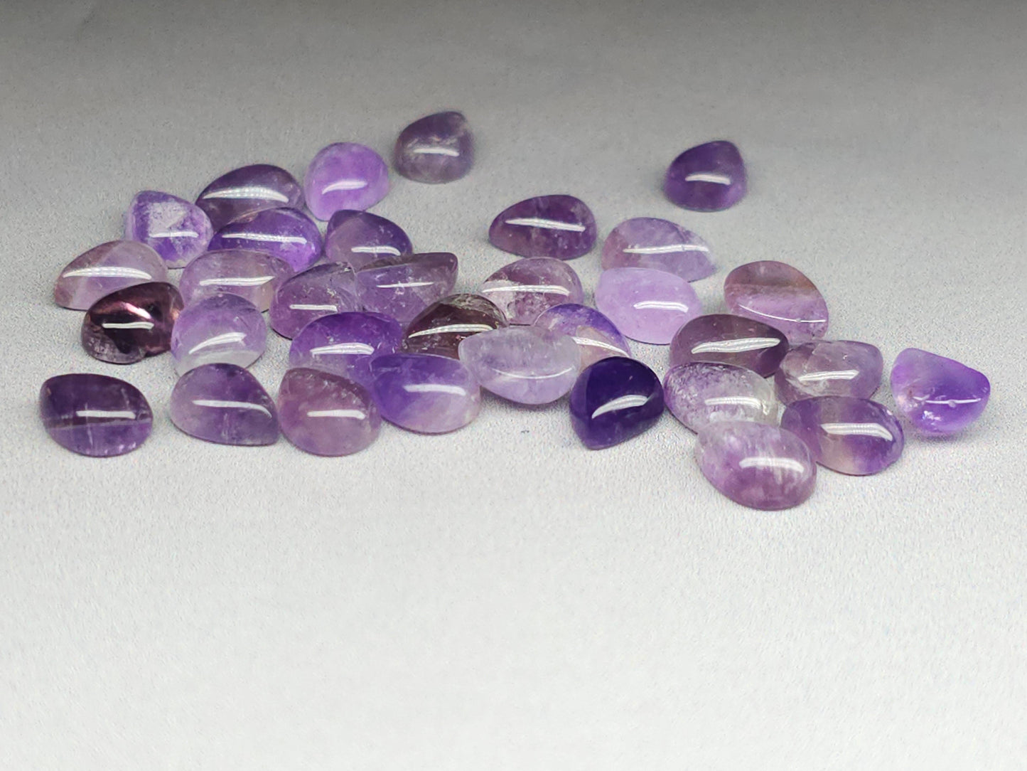 Amethyst cabochon 8mm pear shape close up showing stone clarity